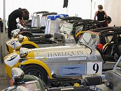 The line of Formula Woman cars in the garage